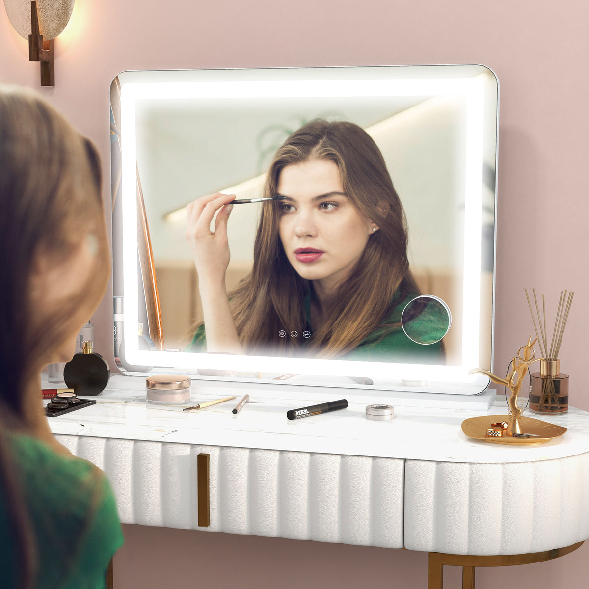 Woman applying makeup in the large LED vanity mirror