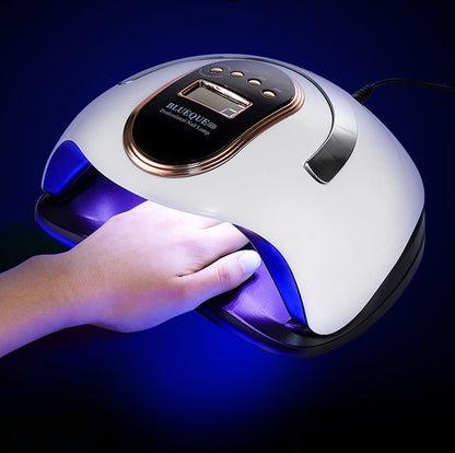 White UV LED nail lamp curing gel nails with the blue light on