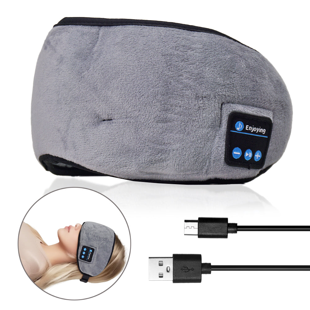 Grey Bluetooth sleep mask with control buttons and USB charging cable