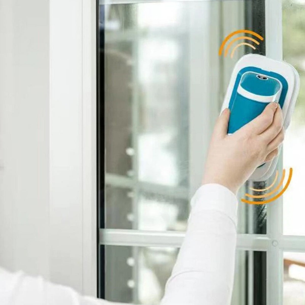 Cordless electric scrubber cleaning a window