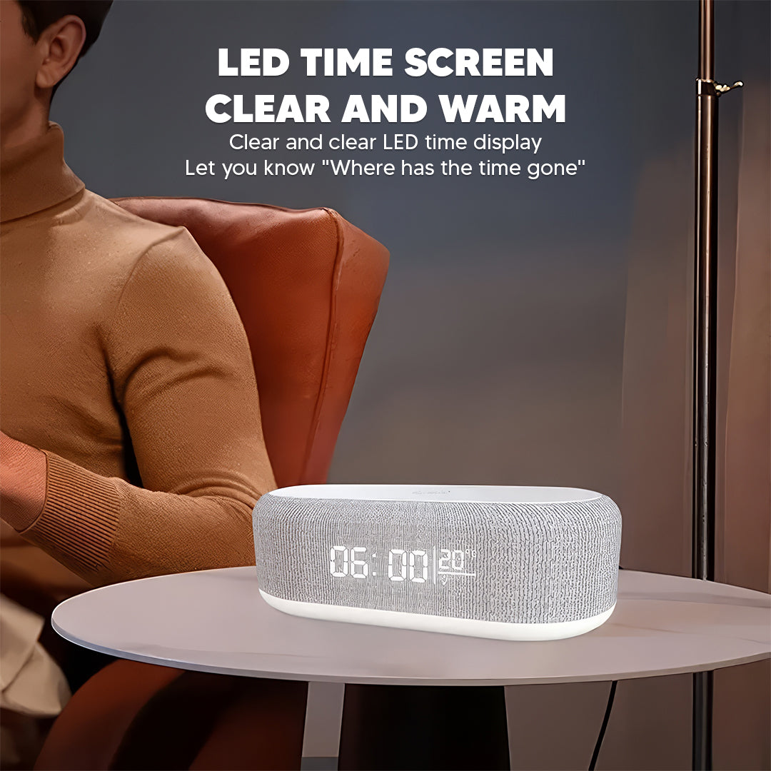 Speaker alarm clock with LED time display on a side table