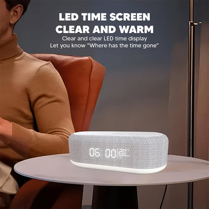 Speaker alarm clock with LED time display on a side table